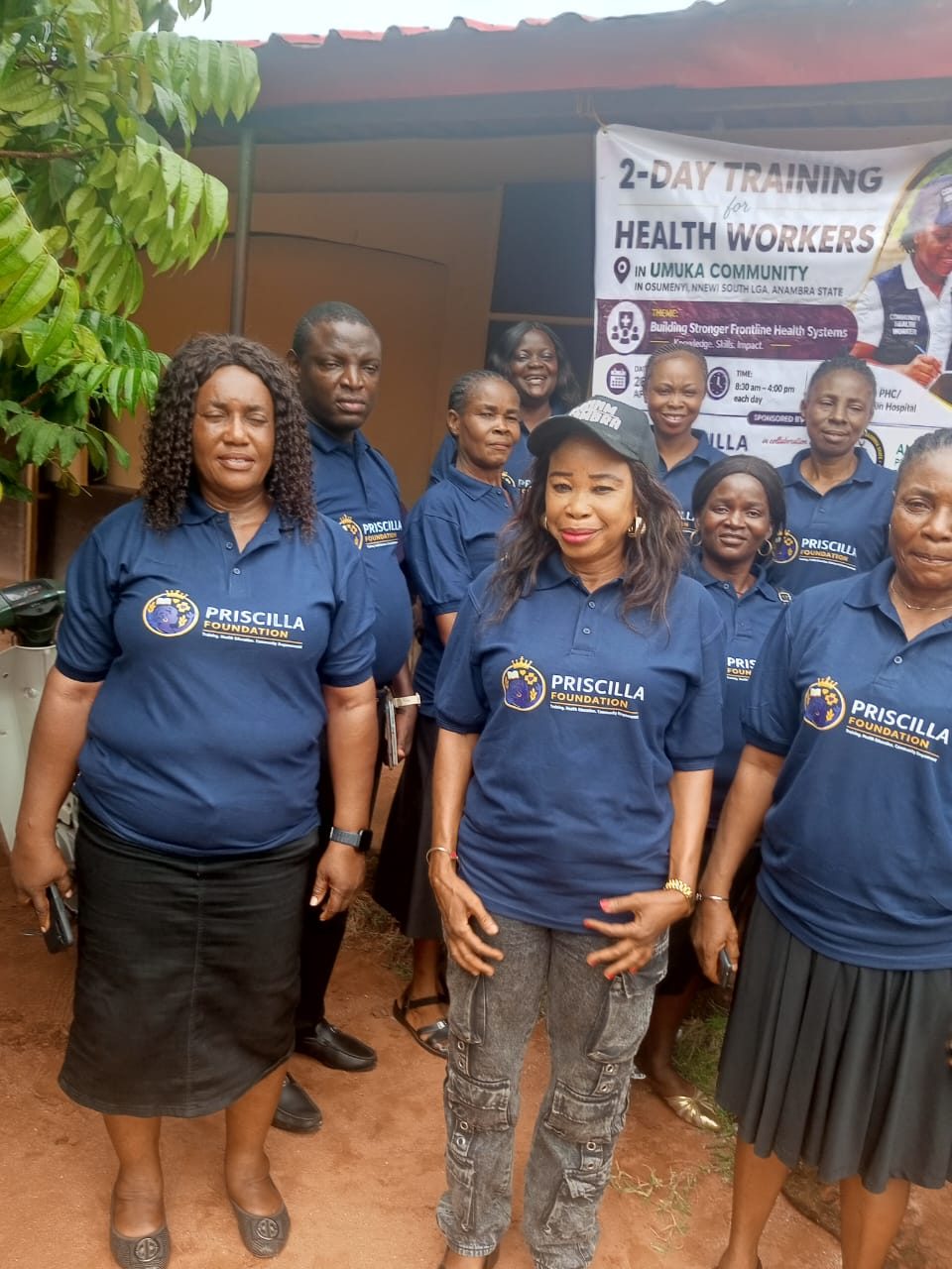 Group of health workers gathered under the 2-Day Training banner